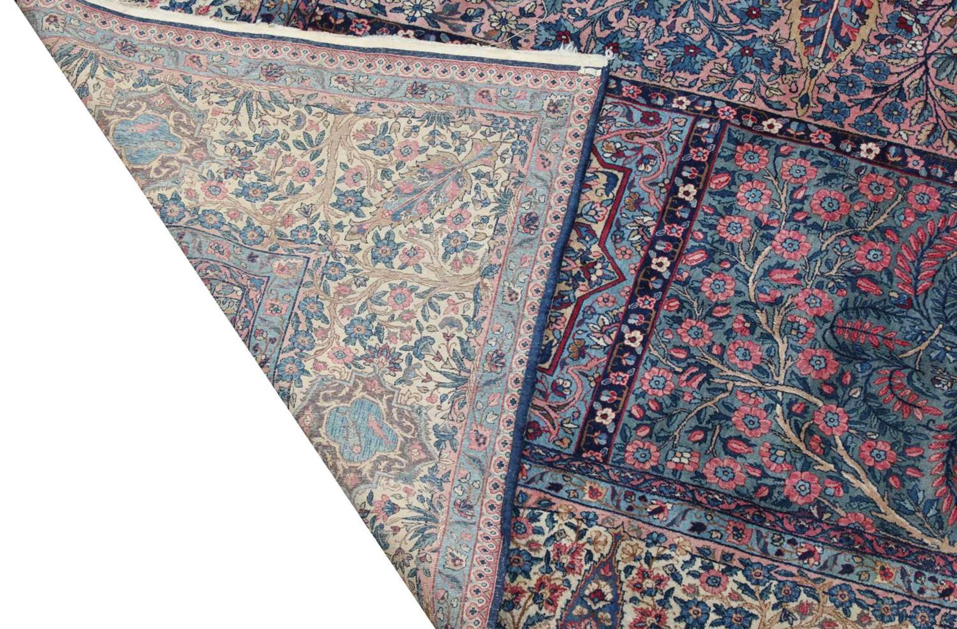 A large Persian Kirman carpet, - Image 2 of 18