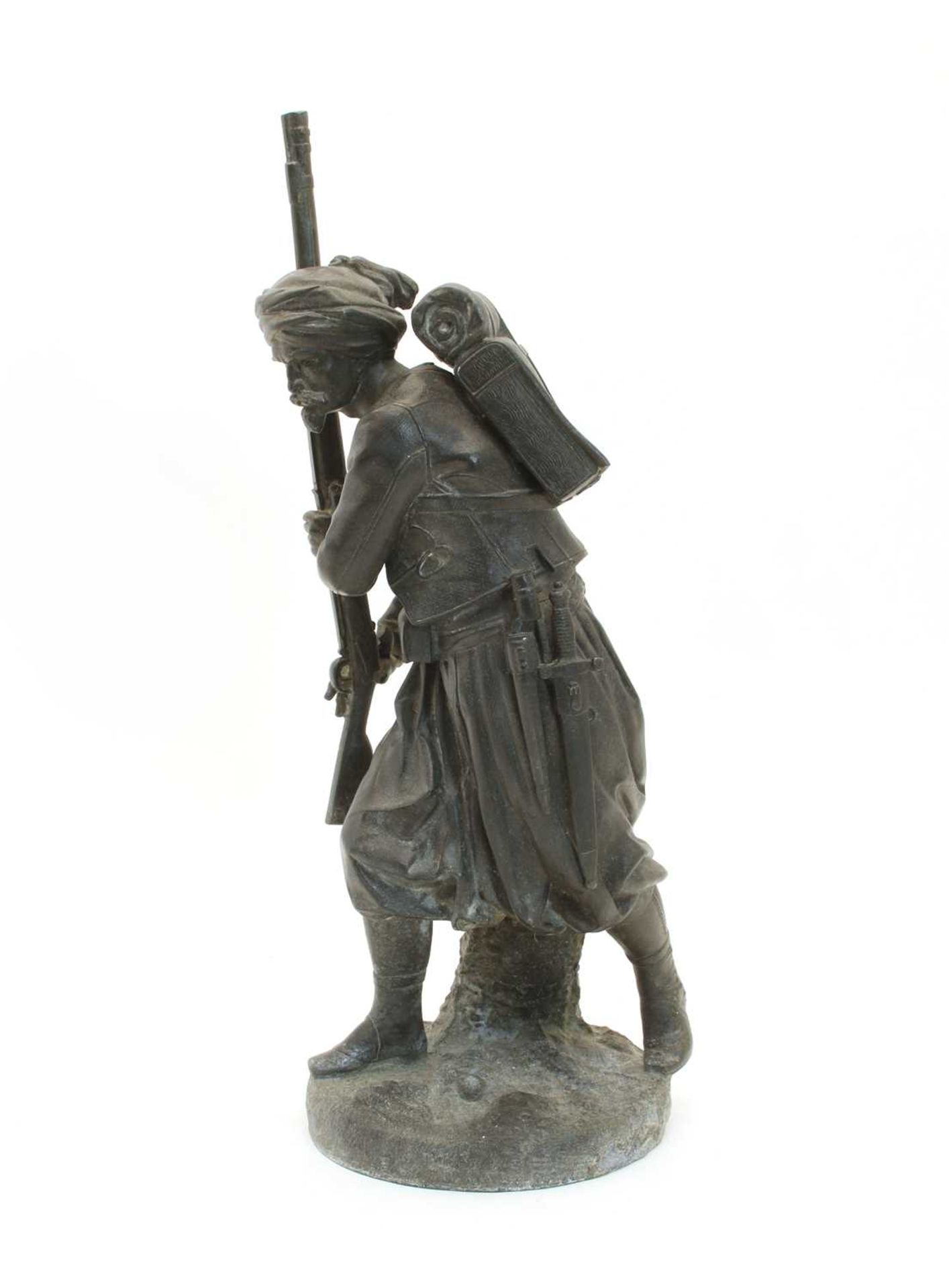 An early 20th Century bronze figure of an Arab,