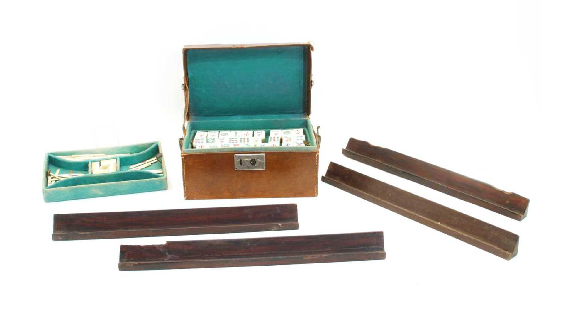 A Chinese leather cased bamboo and bone Mahjong set,