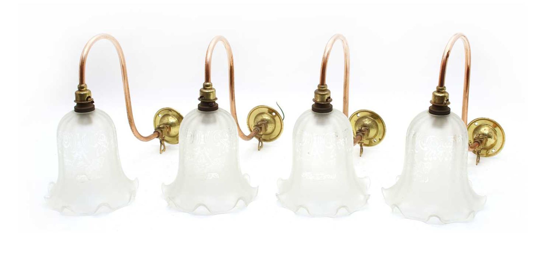 A set of four brass and copper Edwardian gas lamps,