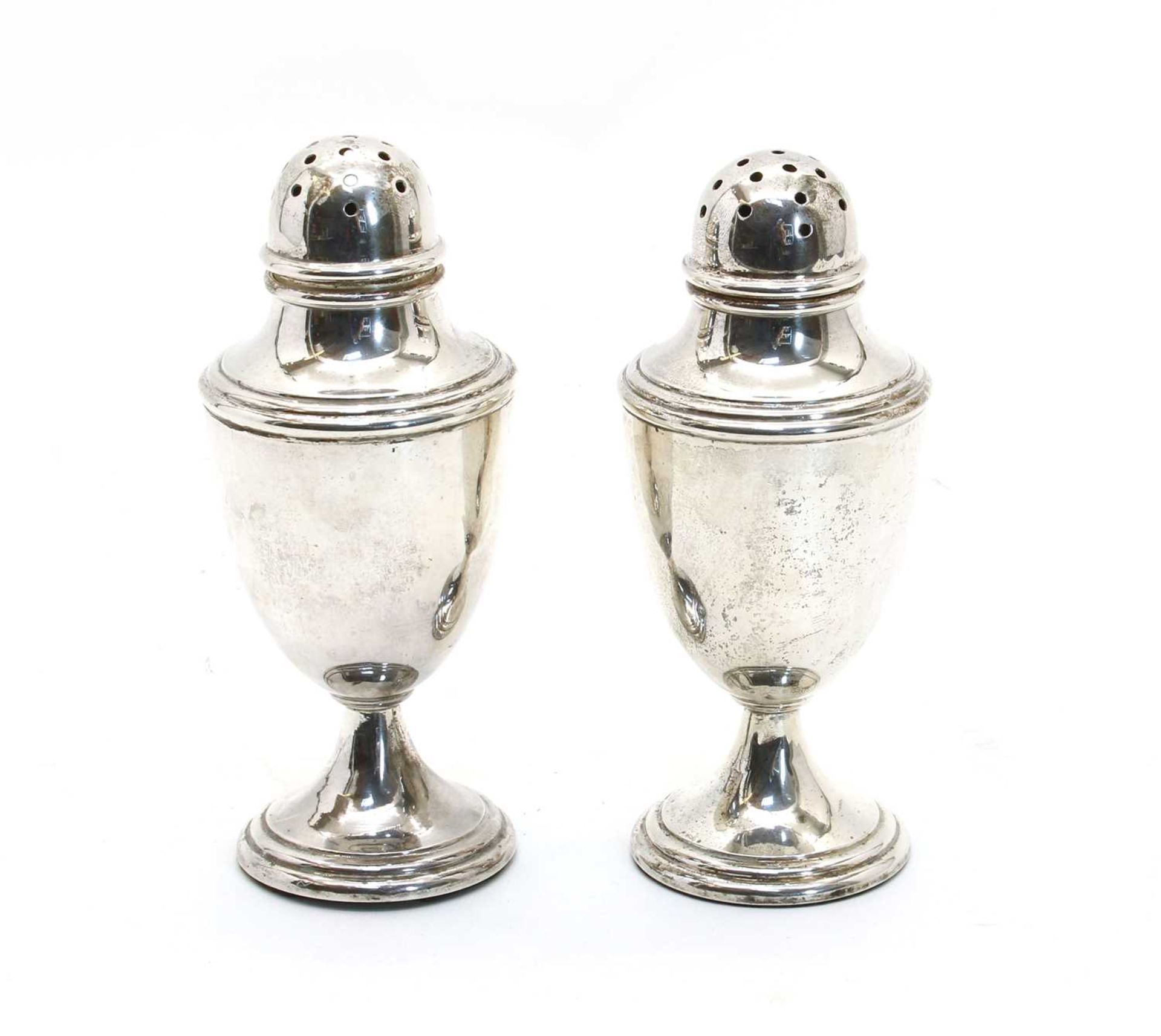 A pair of George V casters of urn design,