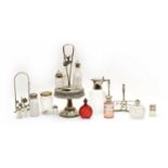 A collection of glass cruets and dressing table items,