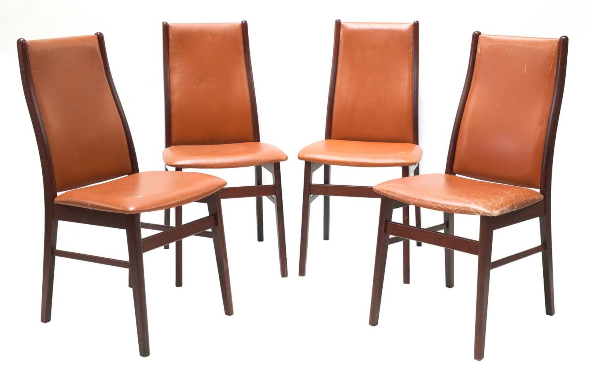 Four Danish tan leather dining chairs,