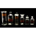 A collection of various modern apothecary jars of varying sizes