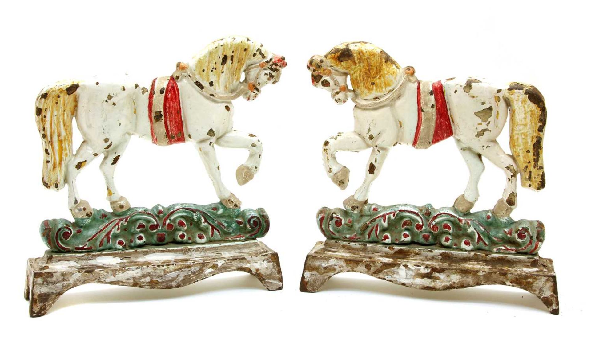 A pair of polychrome decorated door porters,