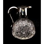 A silver and cut glass jug,