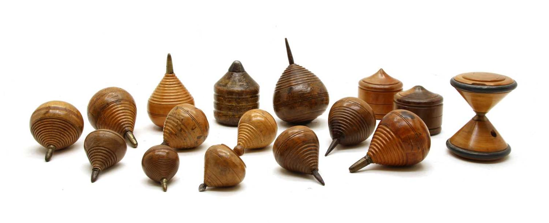 A collection of 19th century treen spinning tops,