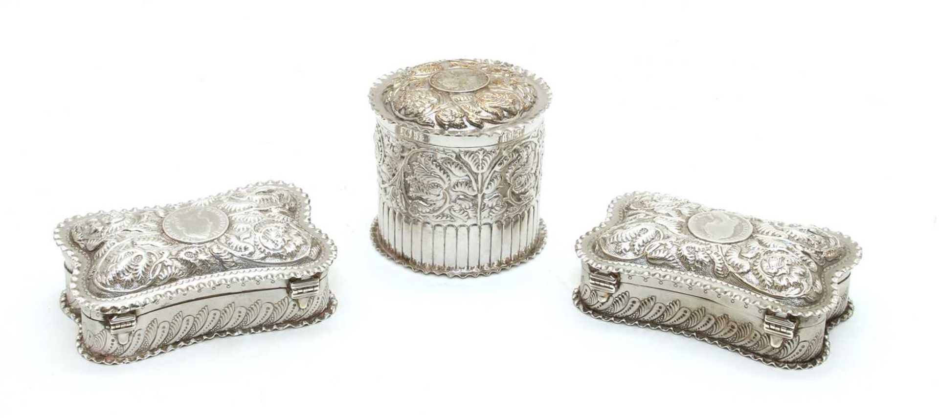 A suite of three silver coin boxes,