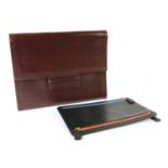 A Jean Patou burgundy leather clutch,