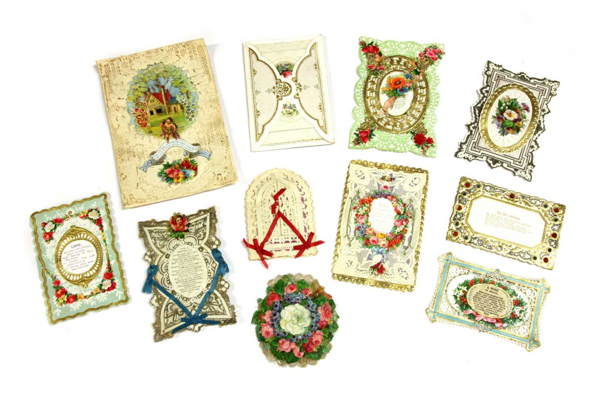 A collection of Victorian and Edwardian hand painted collage cards,