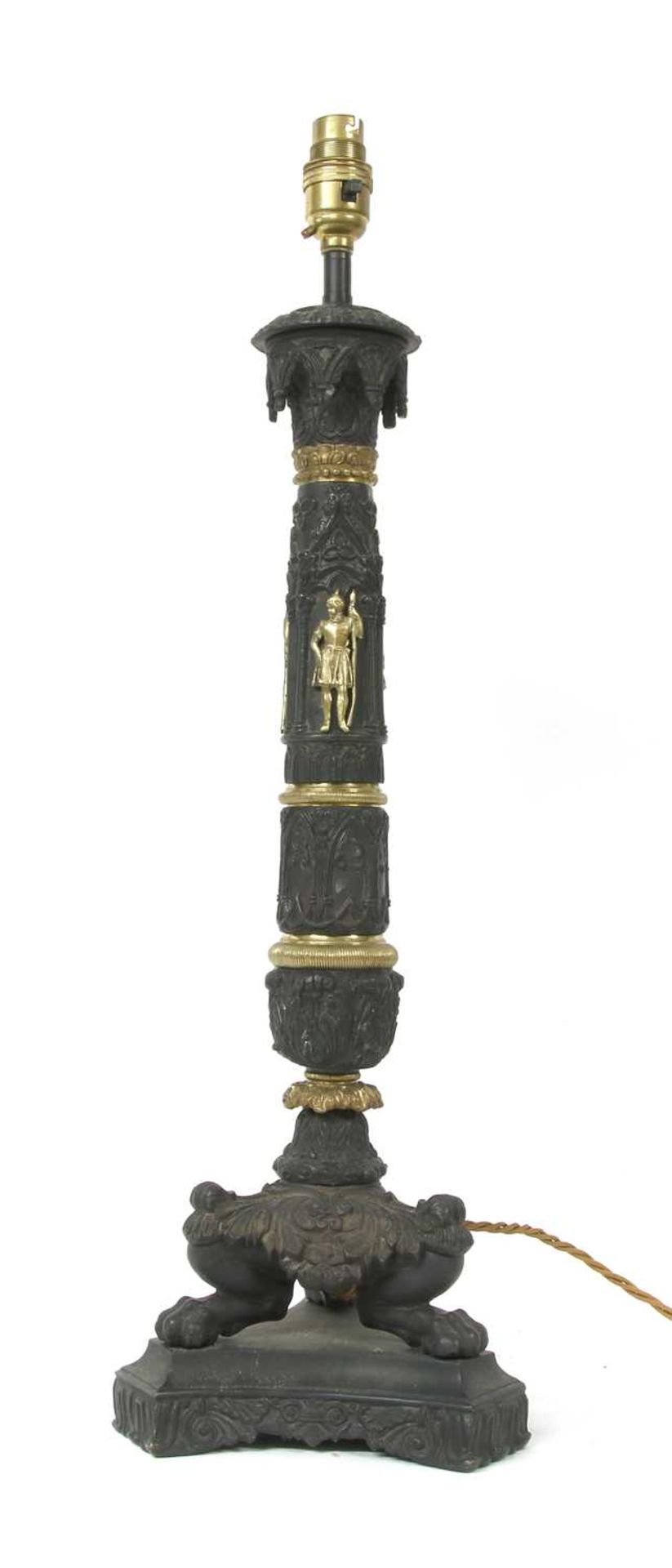 An Empire style ornately ebonised brass table lamp,