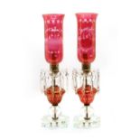 A pair of Victorian style clear and cranberry glass lustre table lamps,