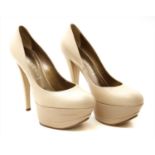 A pair of Casadei cream leather platform shoes