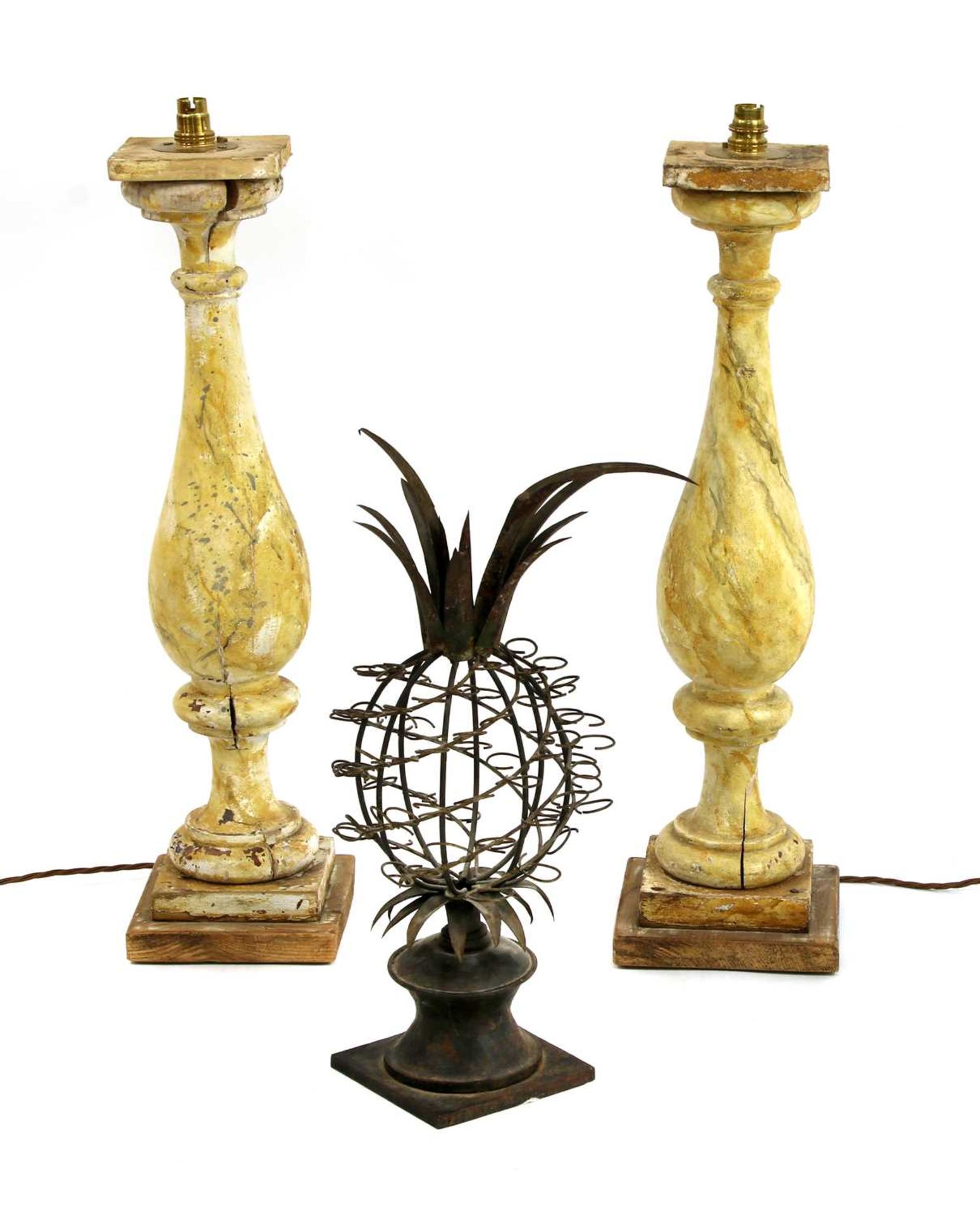 A pair of painted wooden balusters or candlesticks