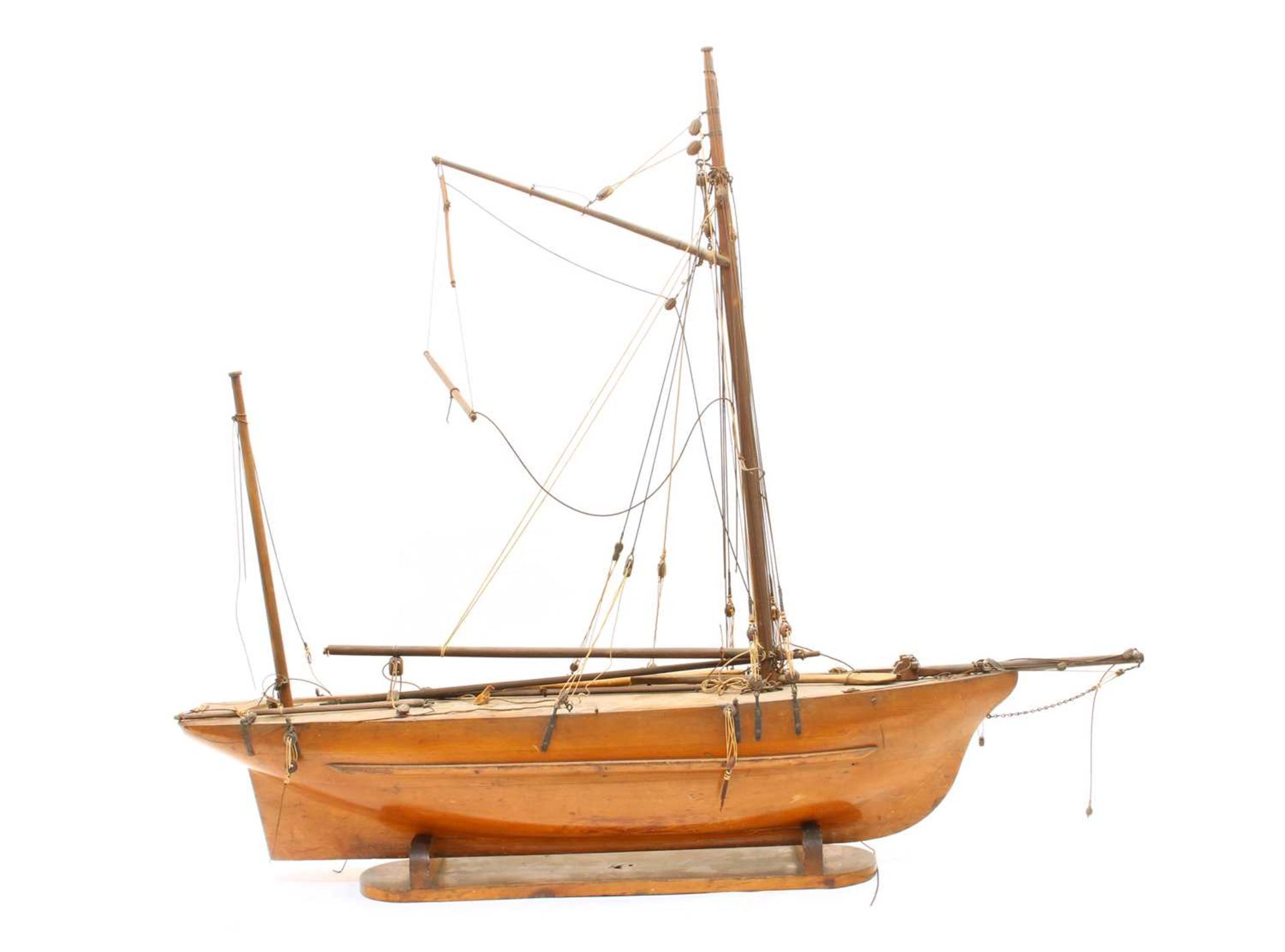 An early 20th Century scratchbuilt model of a ship on stand