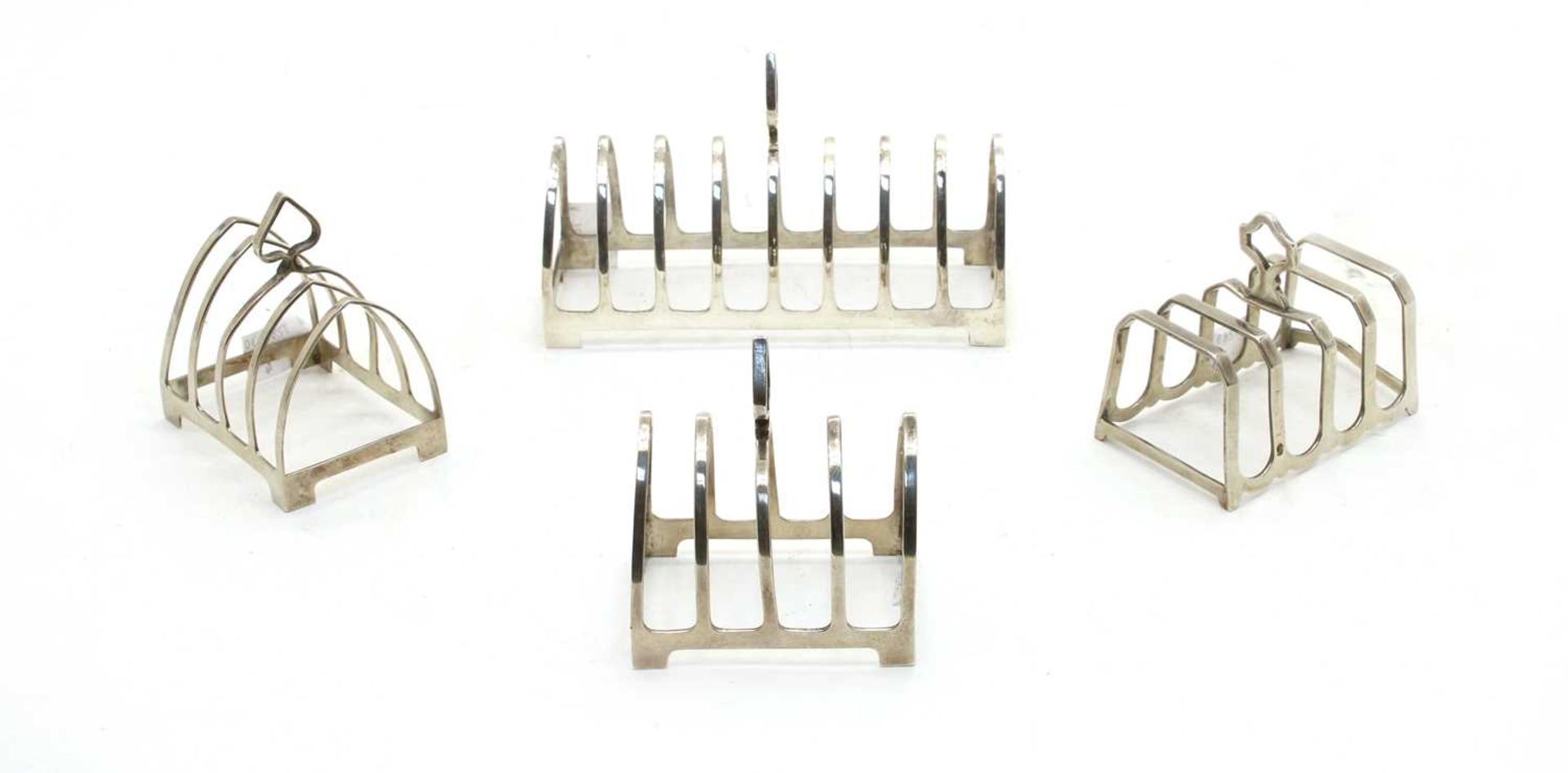 A pair of silver four division toast racks,