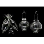 A collection of four glass trio vases