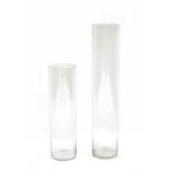 A pair of graduated tall glass vases,