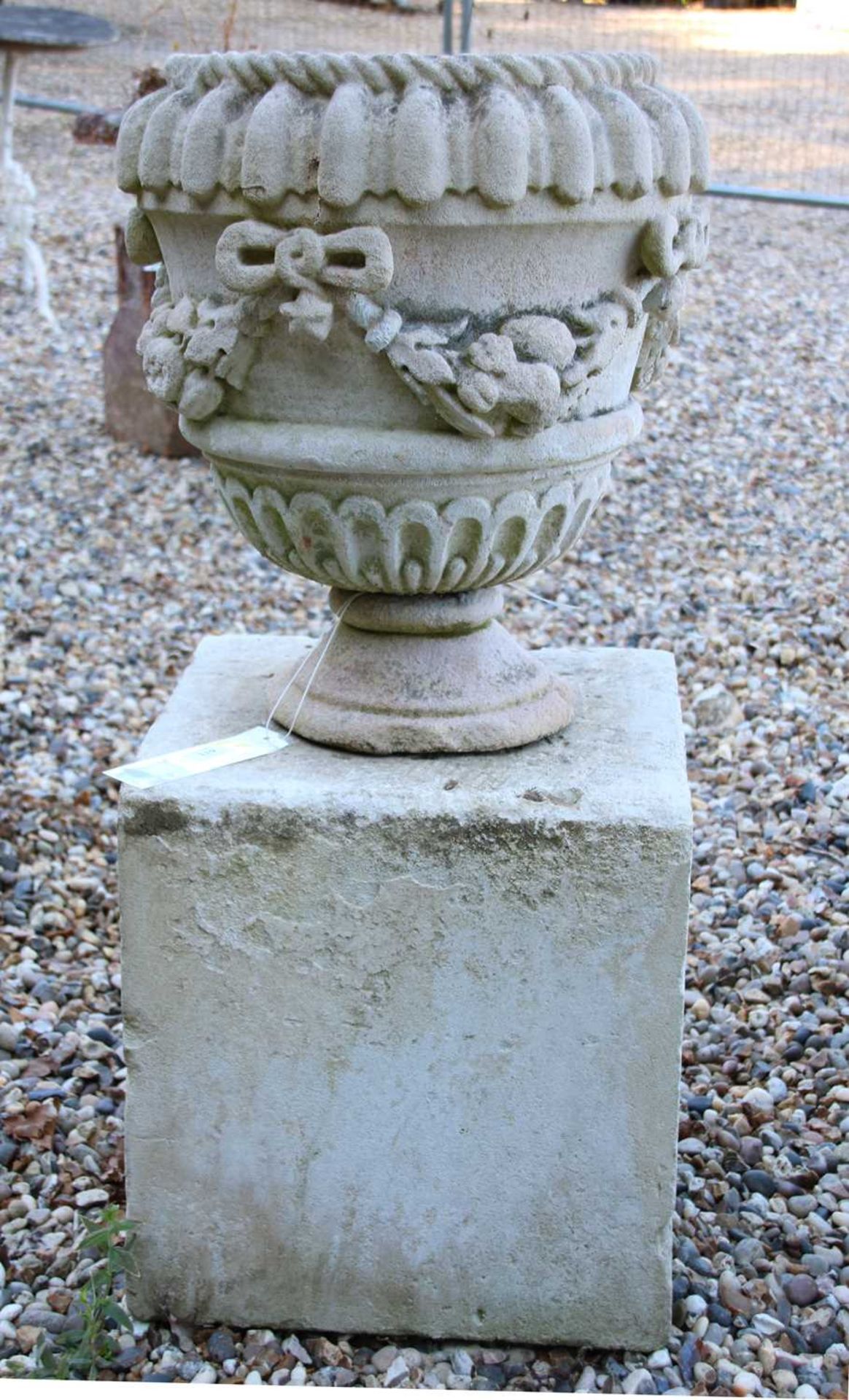 A composition stone urn,