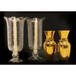 A pair of cut glass engraved hurricane lamps,