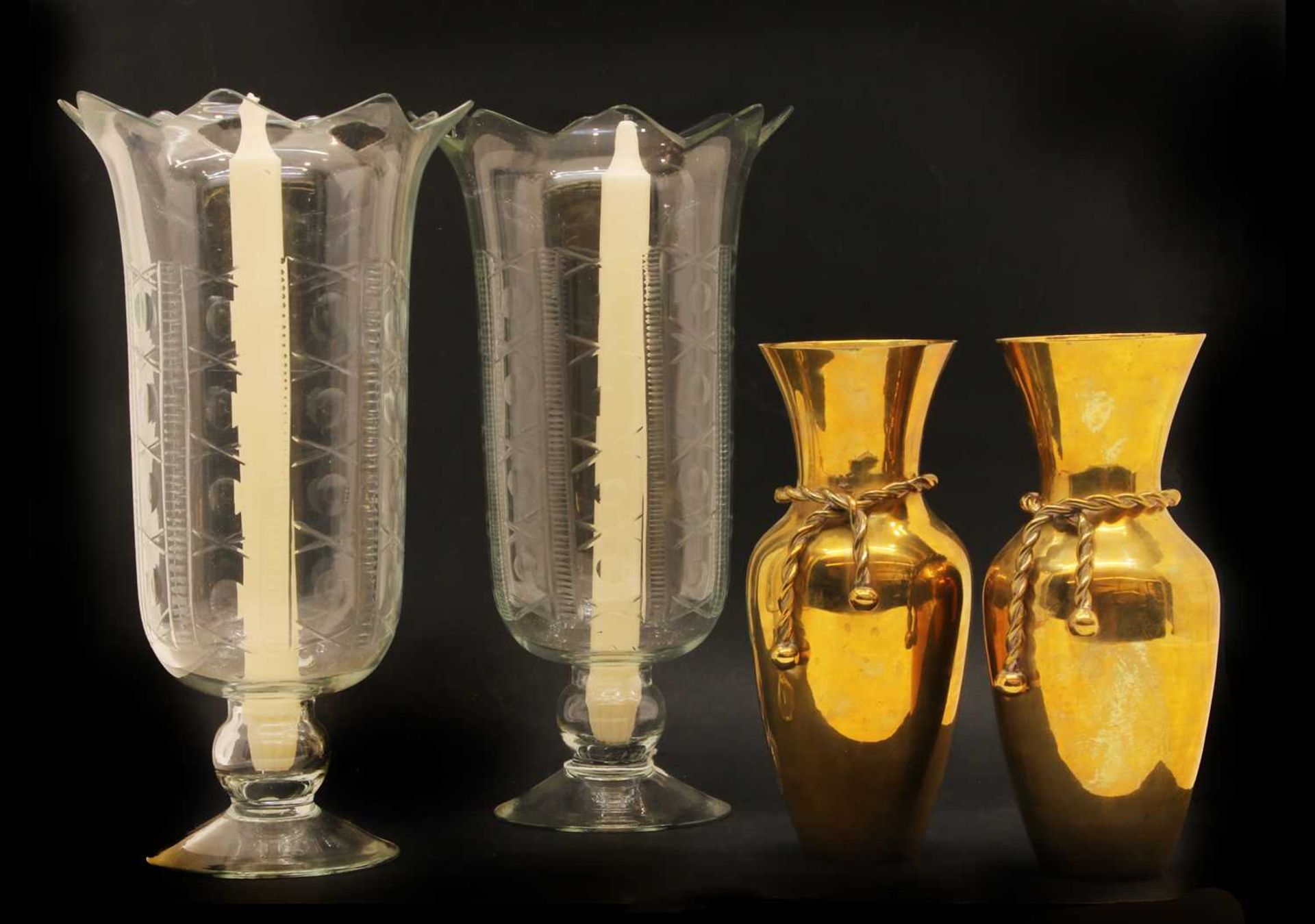 A pair of cut glass engraved hurricane lamps,