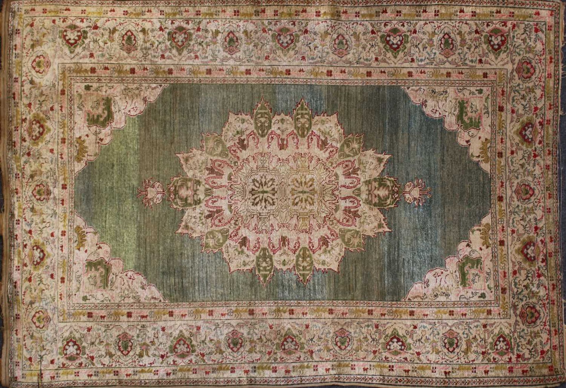 A Persian silk tabriz rug,