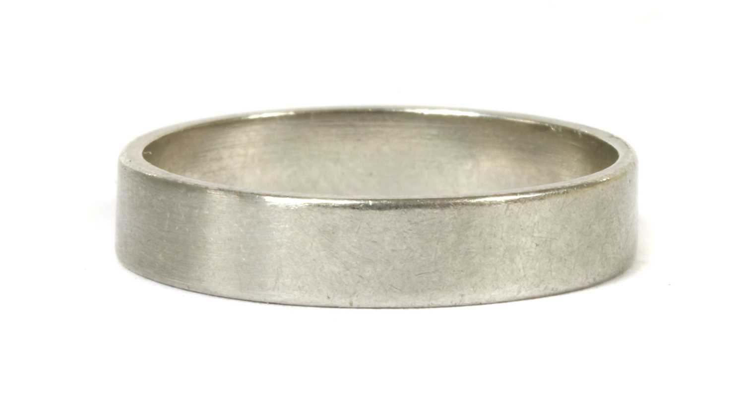 A platinum flat section wedding ring,