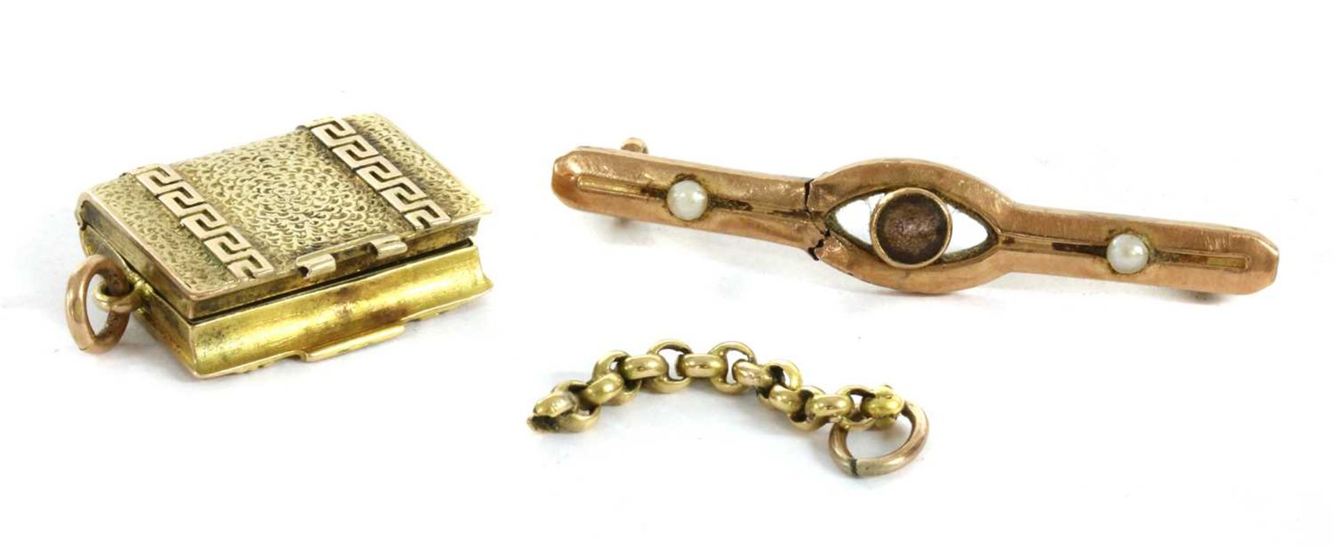 A gold rectangular locket,