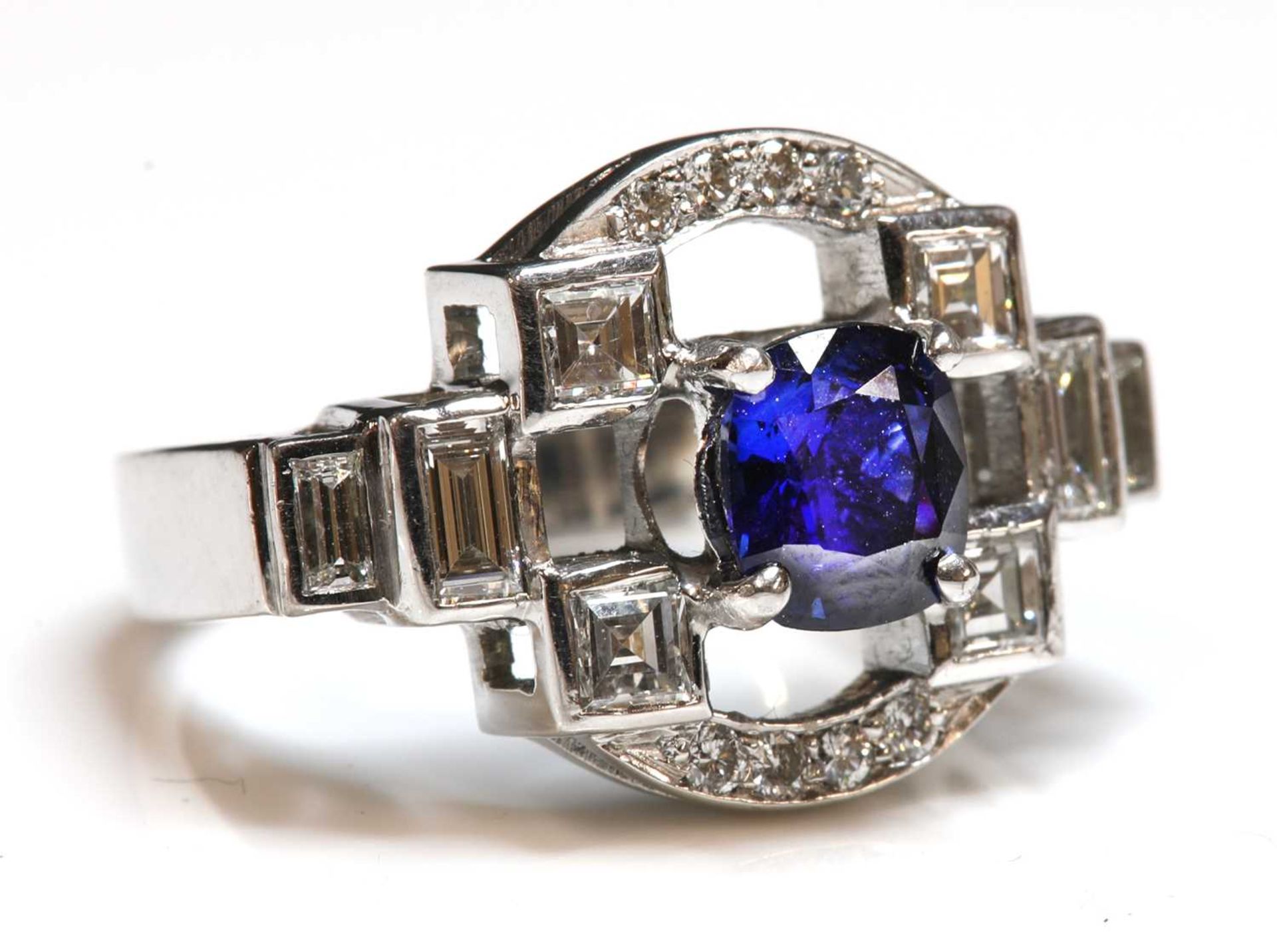 An 18ct white gold sapphire and diamond ring,