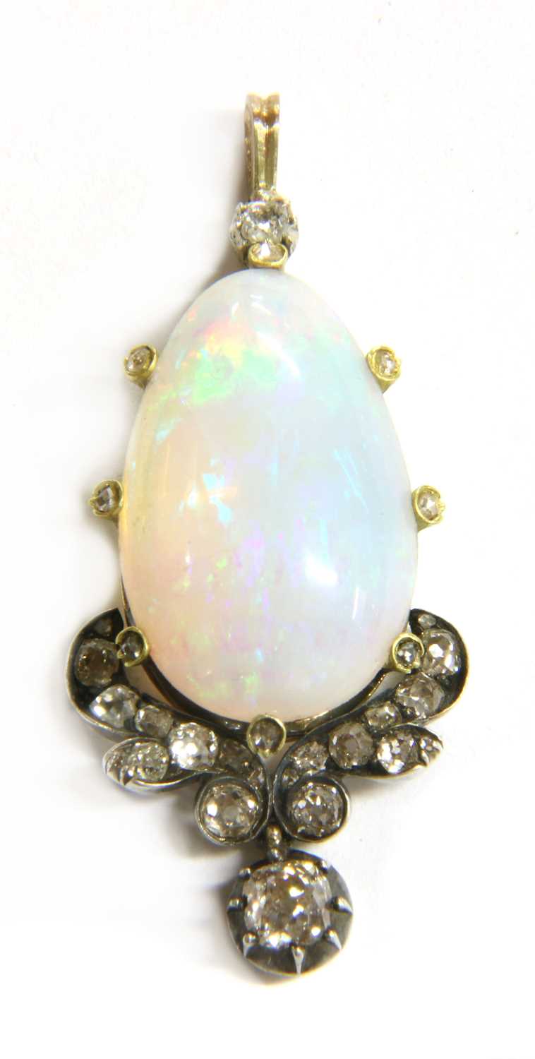 A gold and silver, opal and diamond pendant