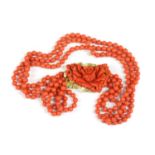 An Italian gold three row uniform coral bead necklace,