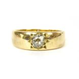 A gold single stone diamond ring