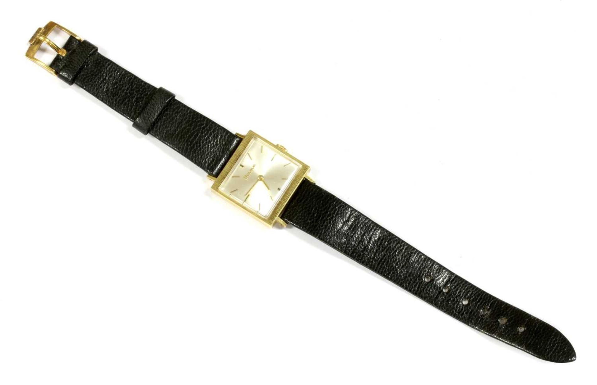 A mid-size 18ct gold Bulova mechanical strap watch,