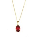 A gold single stone ruby pendant,