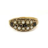 A Victorian 15ct gold garnet and split pearl ring,