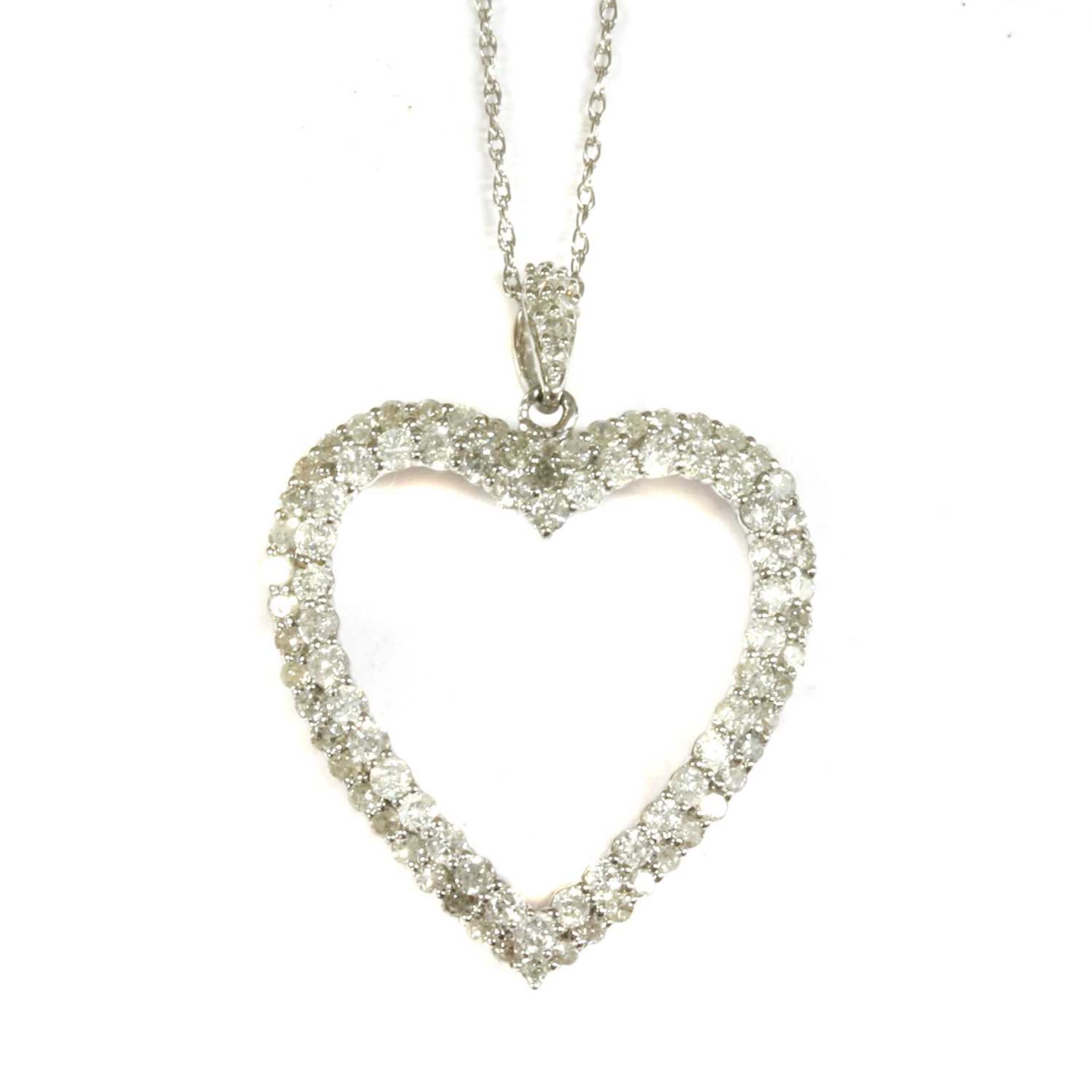 A white gold diamond heart pendant,