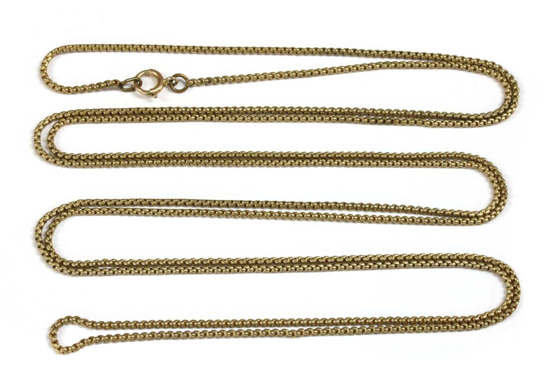 A gilt metal long chain,