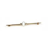 A gold opal and diamond bar brooch,