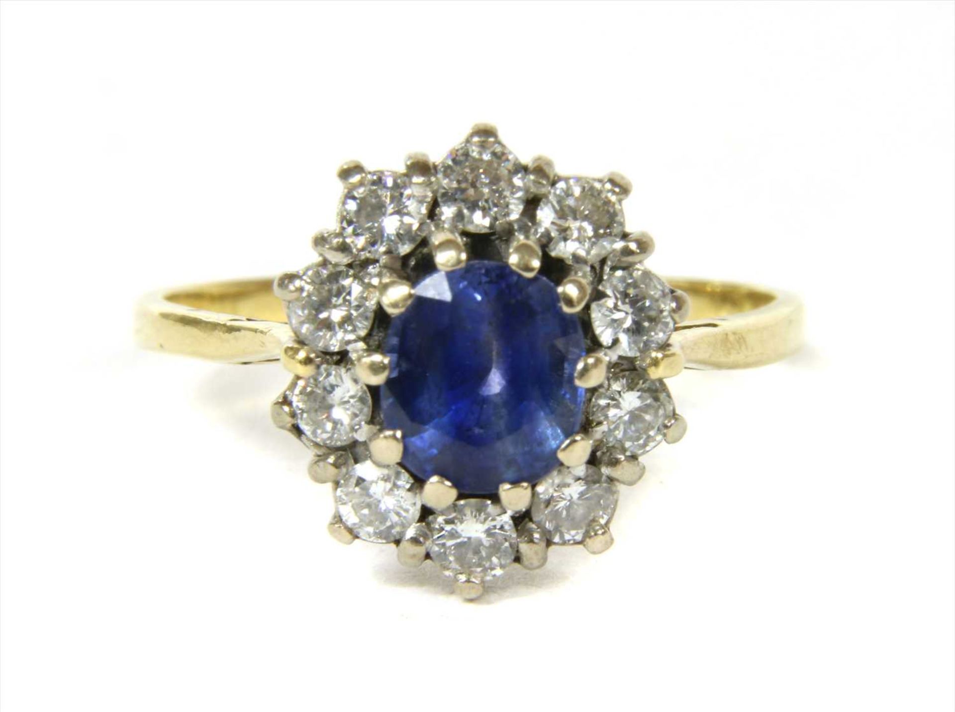 A gold sapphire and diamond cluster ring,