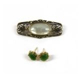 A pair of gold jade stud earrings