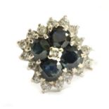 A white gold diamond and sapphire cluster ring,