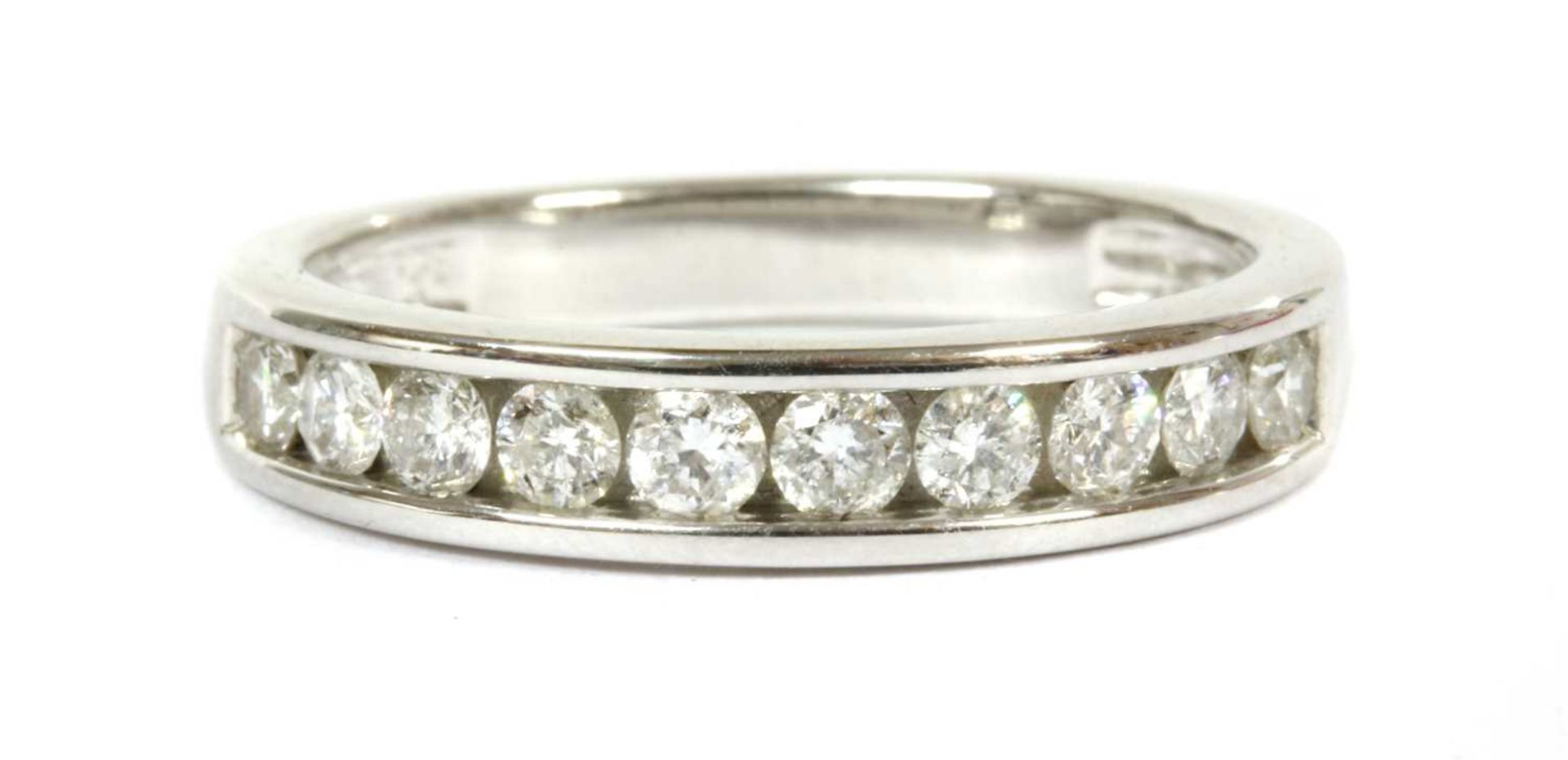 A white gold diamond half eternity ring,