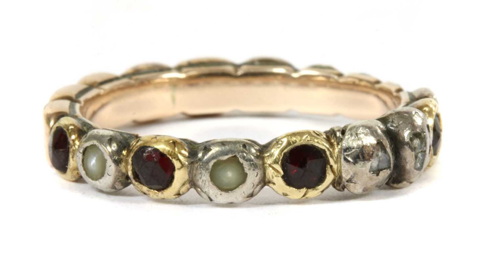 A Georgian silver and gold, garnet, split pearl and diamond full hoop ring,