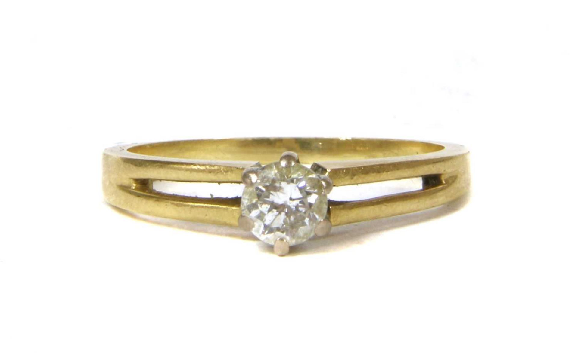 An 18ct gold single stone diamond ring,