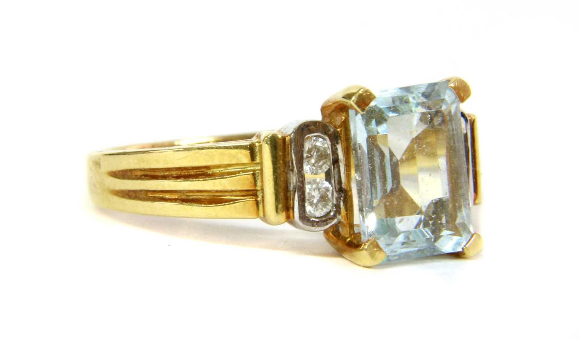 An 18ct gold aquamarine and diamond ring,