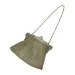 A silver mesh purse,