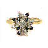 An 18ct gold diamond and sapphire cluster ring,