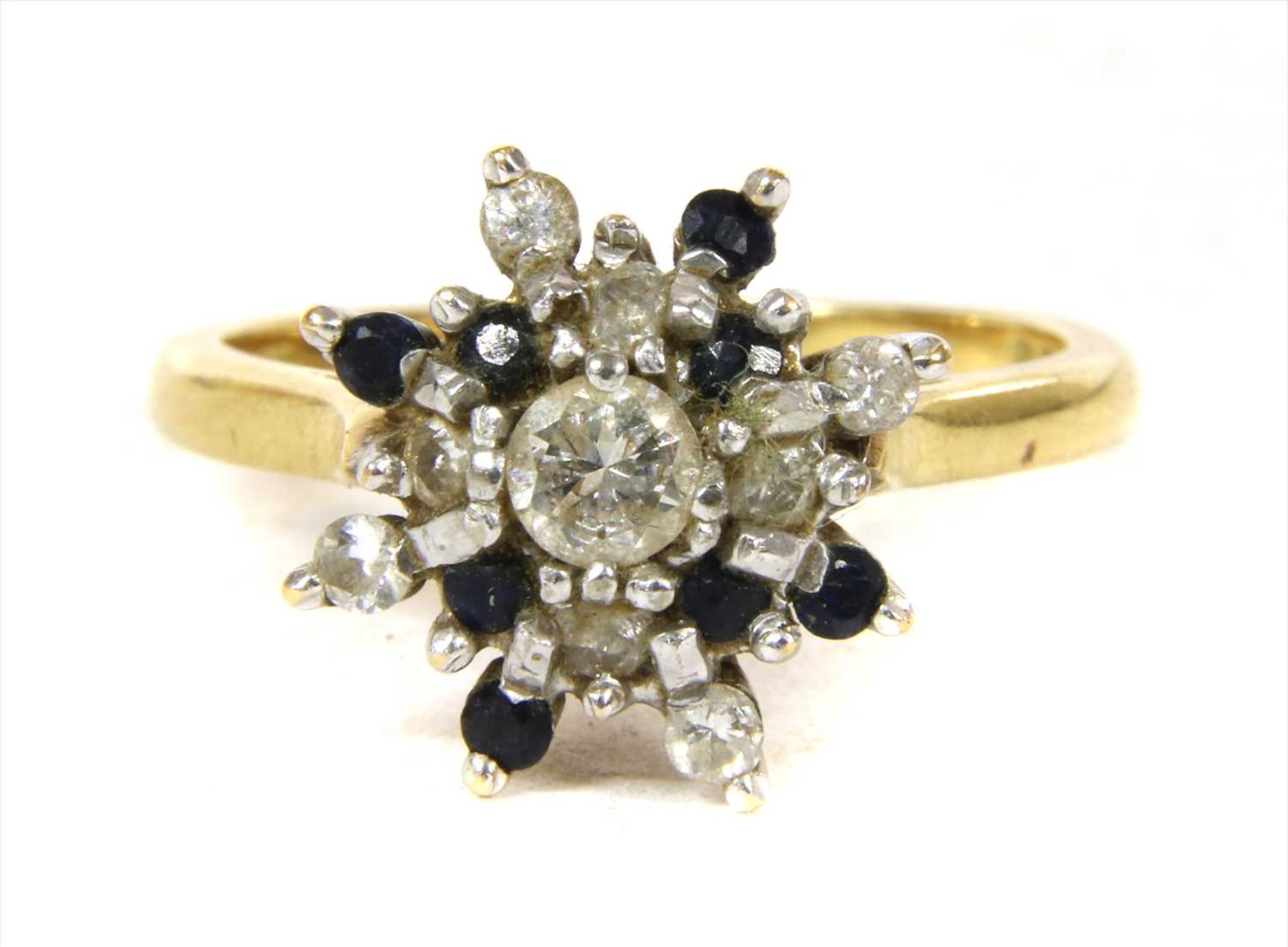 An 18ct gold diamond and sapphire cluster ring,