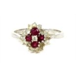 An 18ct white gold diamond and ruby cluster ring,