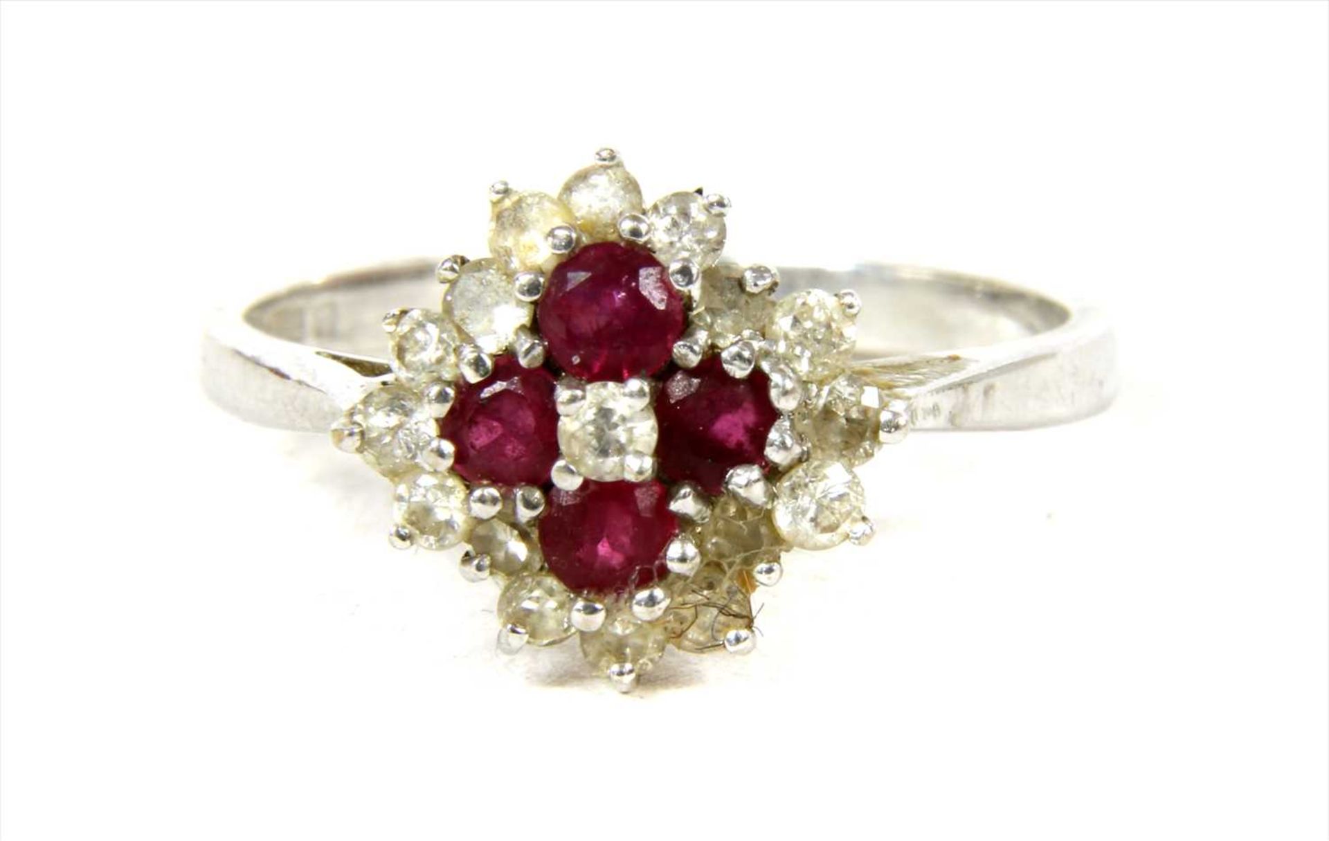 An 18ct white gold diamond and ruby cluster ring,